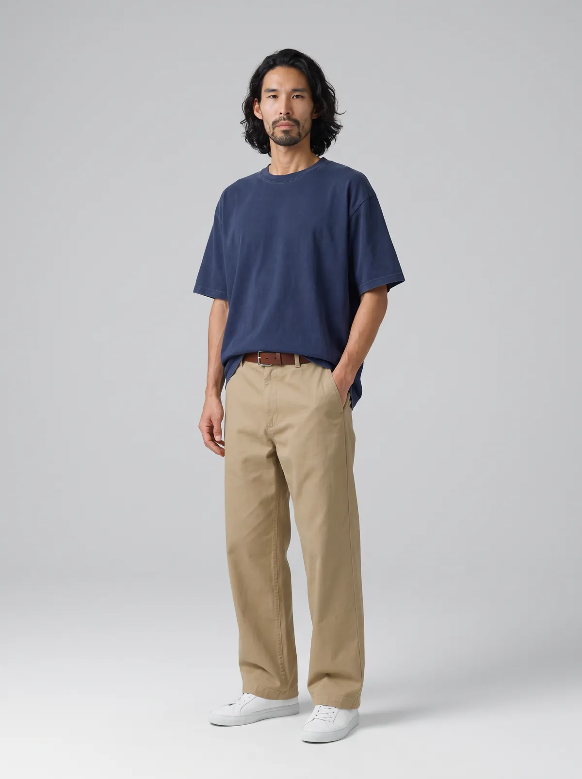 Setset AI product photography of the same navy tee and flat-front khaki chino, with the garment construction, fabric wash and natural creasing reproduced accurately