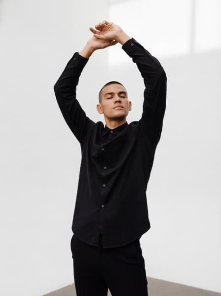 Model in black shirt pose